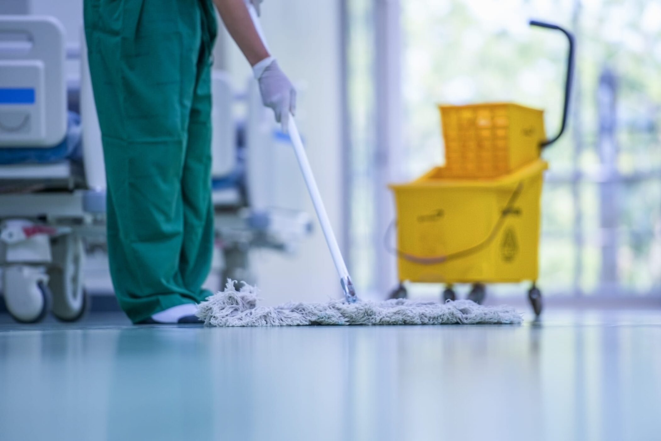 Close-up of cleaner mopping the floor