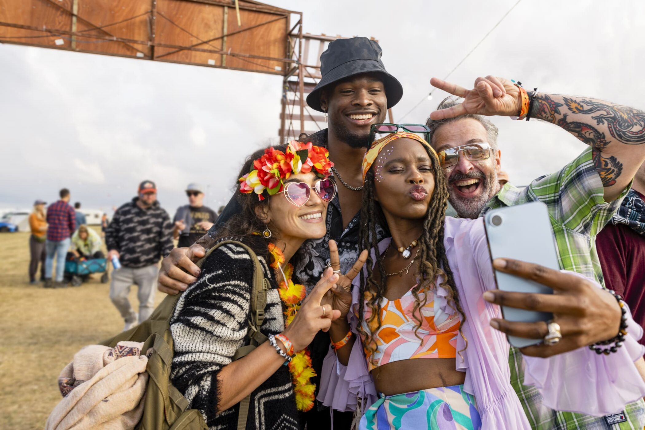 a group of friends taking selfie at a festival