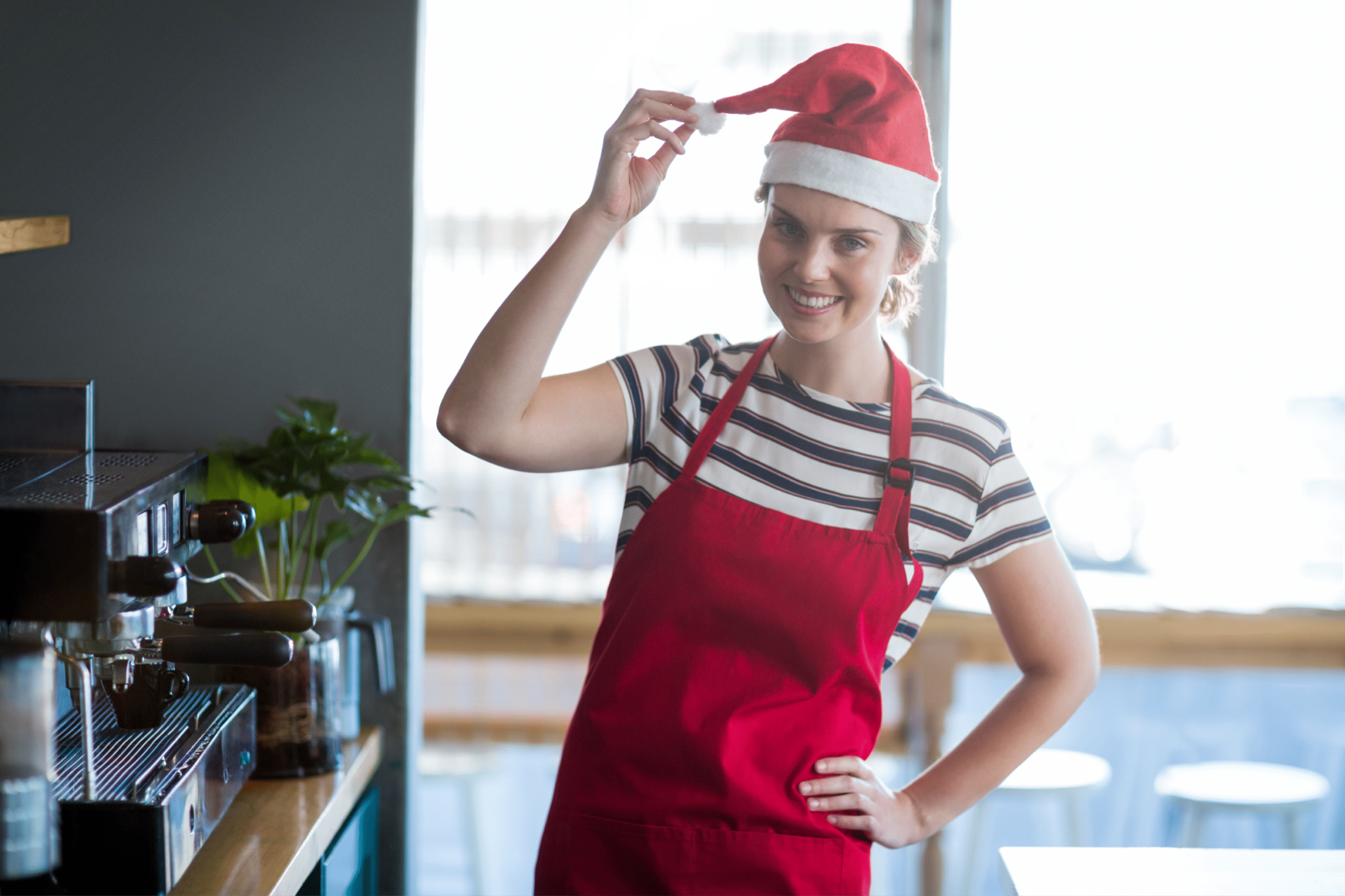 Women wearing a Christmas hat working in hospitality
