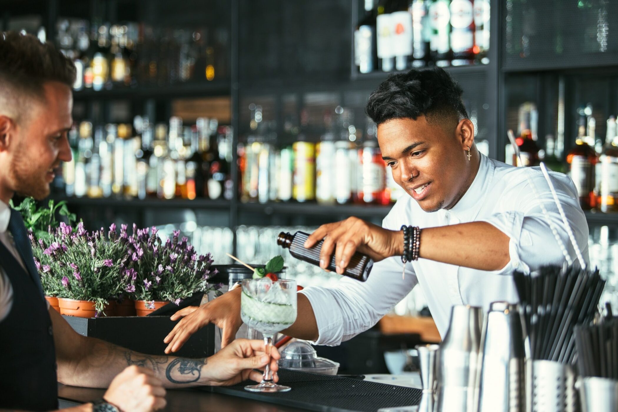 Bartender making cocktails at a bar